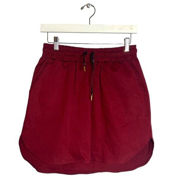 never a wallflower Dresses & Skirts - Never a wallflower track skirt maroon Sz m pull on.